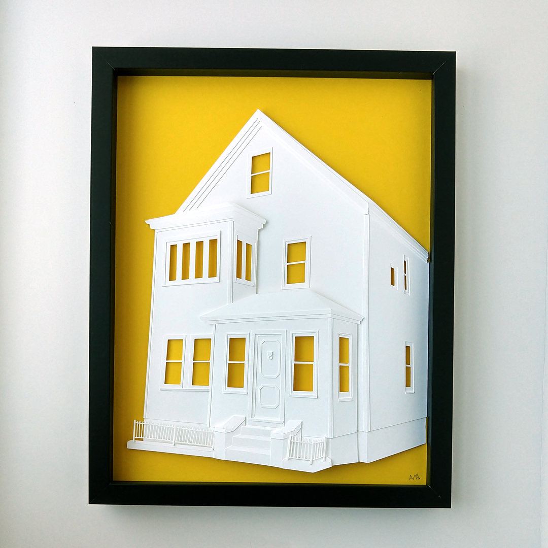 Finished paper house portrait on bright yellow background