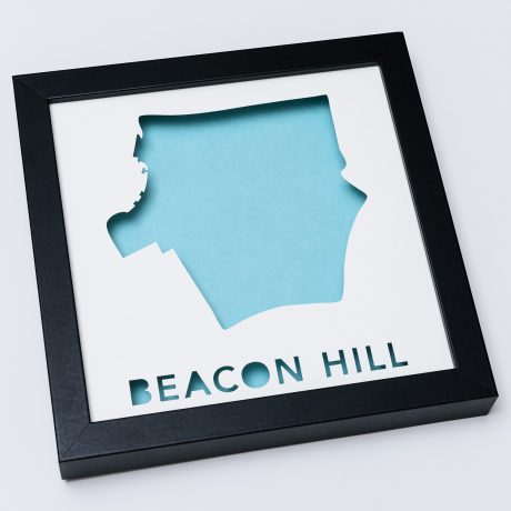 a black frame with a blue cut out of the shape of a map