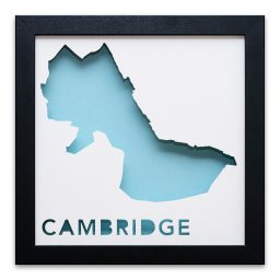 a blue cut out of paper with the word cambridge in it