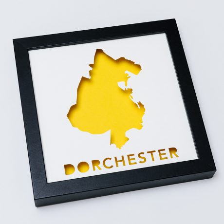 a black frame with a yellow map cut out of it