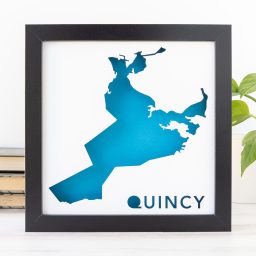 a framed blue map of the City of Quincy, MA