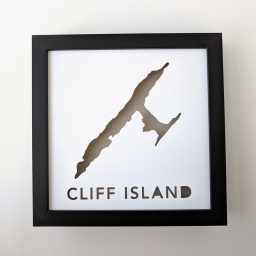 a black frame with a cut out of a island