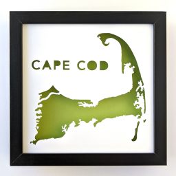 a green and black framed map of cape cob