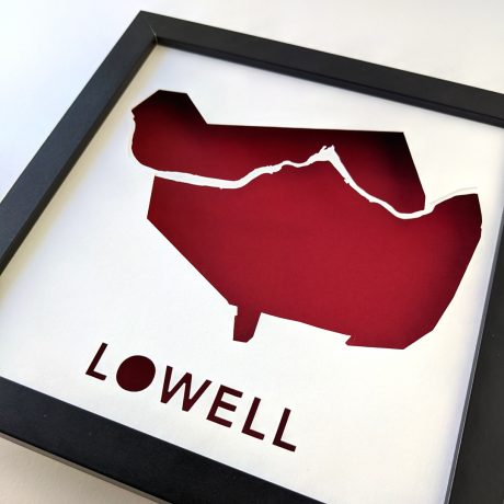 a red piece of paper with the word lowell cut into it