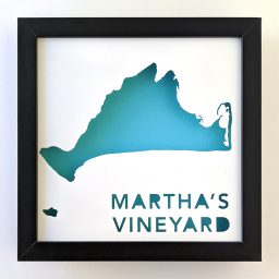 a black frame with a blue and white map of martha's vineyard