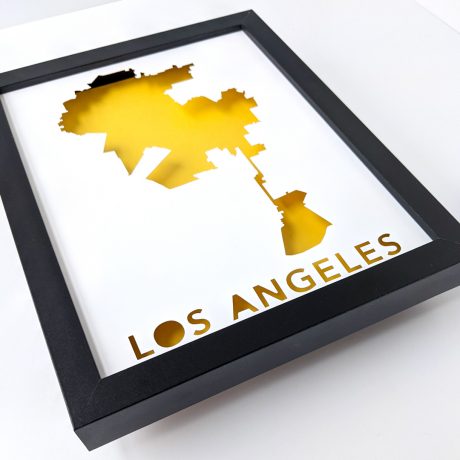 a framed poster with the words los angeles on it