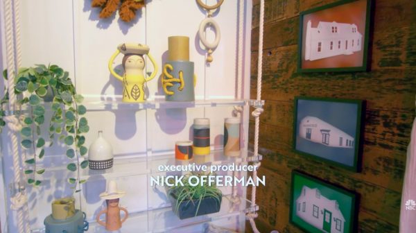 A still from the "Making It" title sequence showing various handmade objects and plants decorating the inside of the barn, where the show is filmed and the words "Executive Producer Nick Offerman"