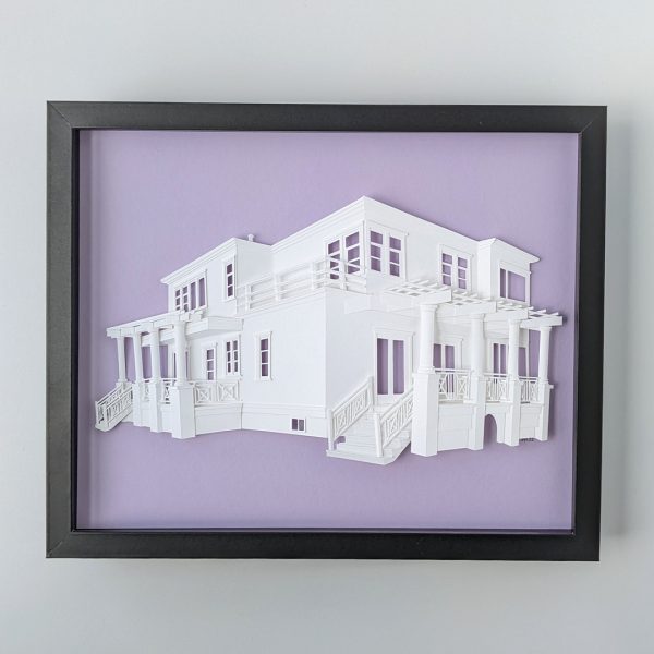 A portrait of a home with two large porches covered by trellises on a lilac background in a black frame.