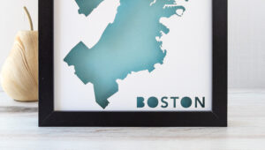 a black frame with a blue map of boston